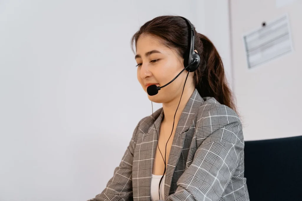 Customer support professional working with a headset