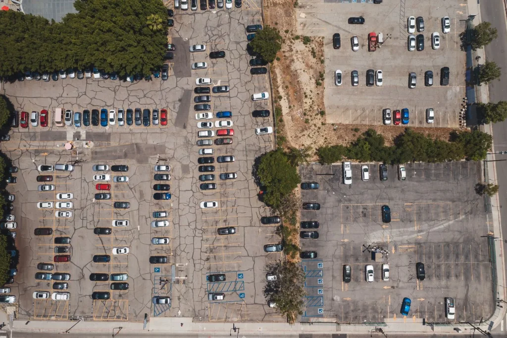 Aerial view of marked parking spaces and parked cars